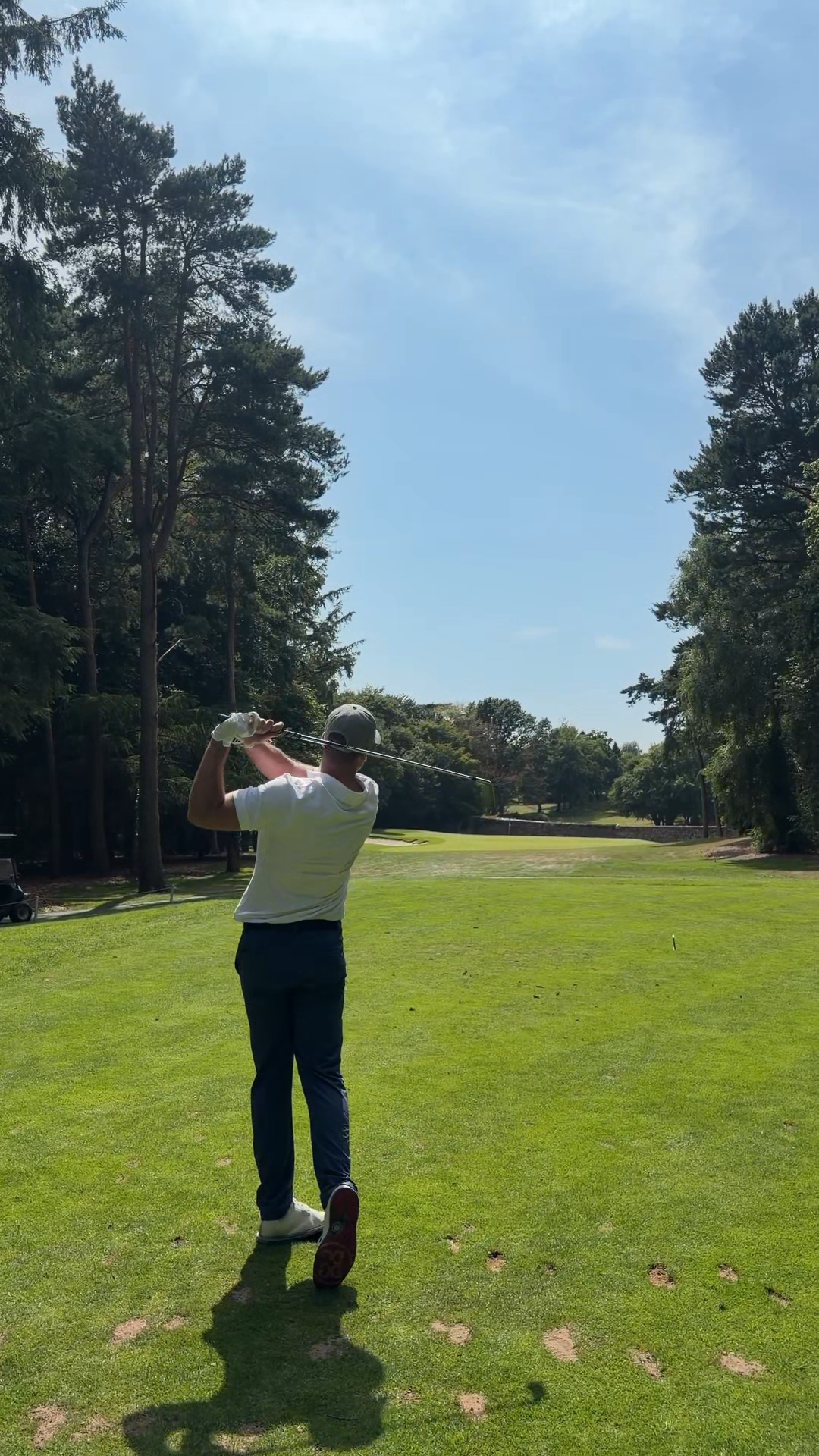 Gary McGrane coaching a golfer on the range at Drynam Park Golf Centre